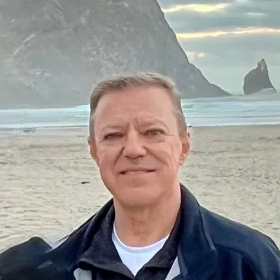 Dennis Winten, founder of Diakryon, on the beach at Cannon Beach, Oregon